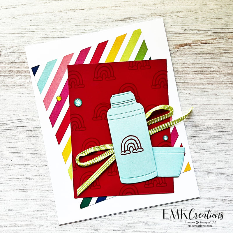 Blue thermos on red background with rainbows by EMK Creations