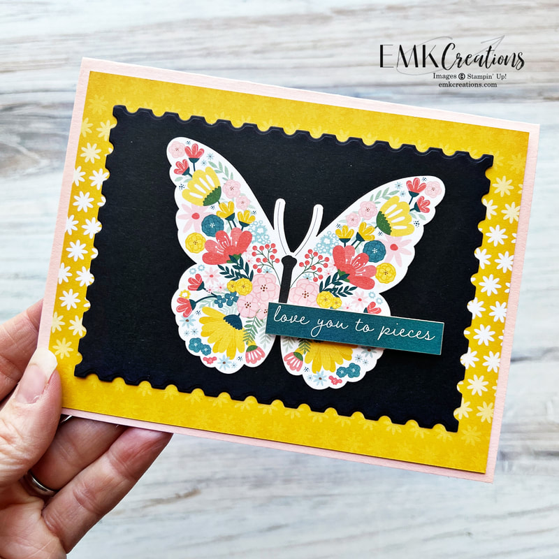 Card with large butterfly filled with flowers on black backgound mounted on yellow and pink layers by EMK Creations